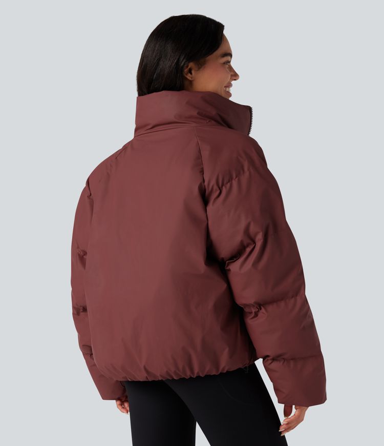 oversize-pufferjacke mit hohem kragen kordelzug am saum und taschen