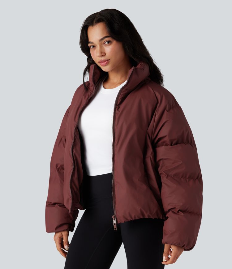 oversize-pufferjacke mit hohem kragen kordelzug am saum und taschen