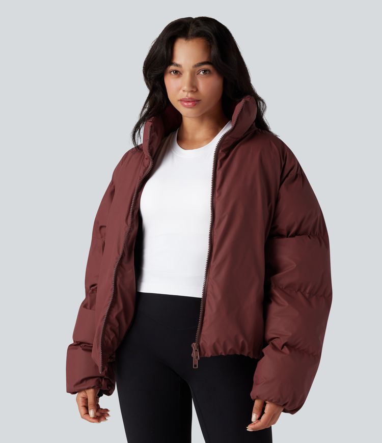 oversize-pufferjacke mit hohem kragen kordelzug am saum und taschen