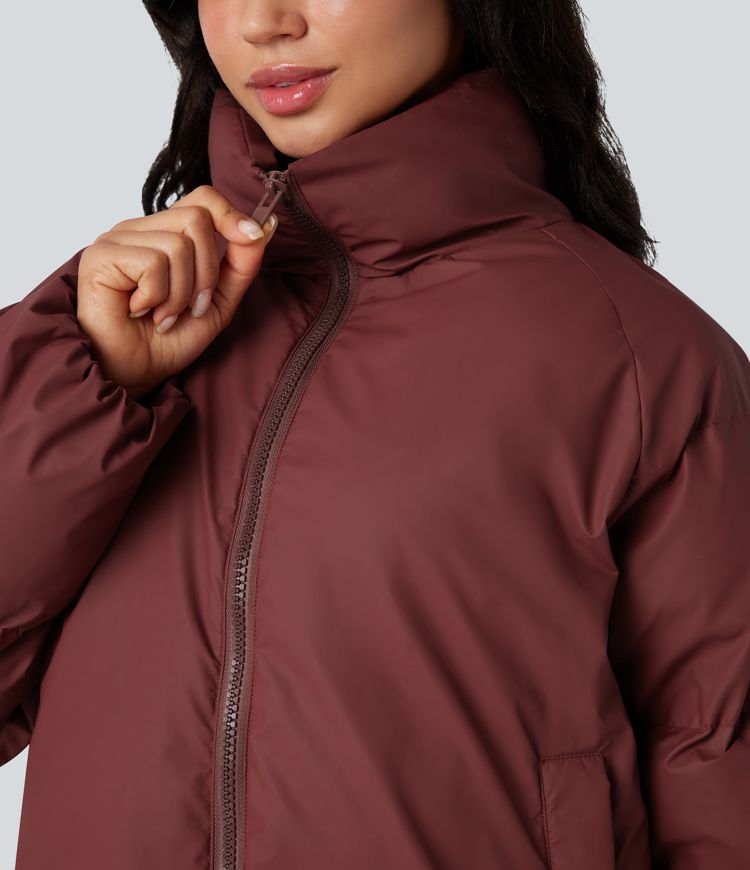 oversize-pufferjacke mit hohem kragen kordelzug am saum und taschen