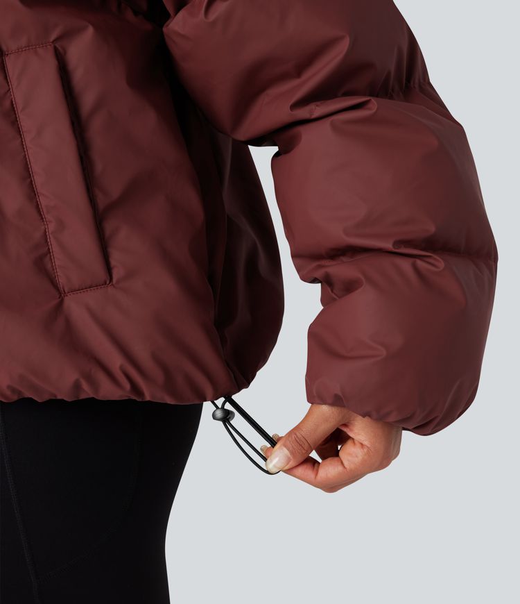 oversize-pufferjacke mit hohem kragen kordelzug am saum und taschen