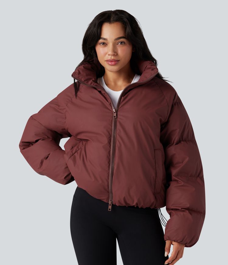 oversize-pufferjacke mit hohem kragen kordelzug am saum und taschen