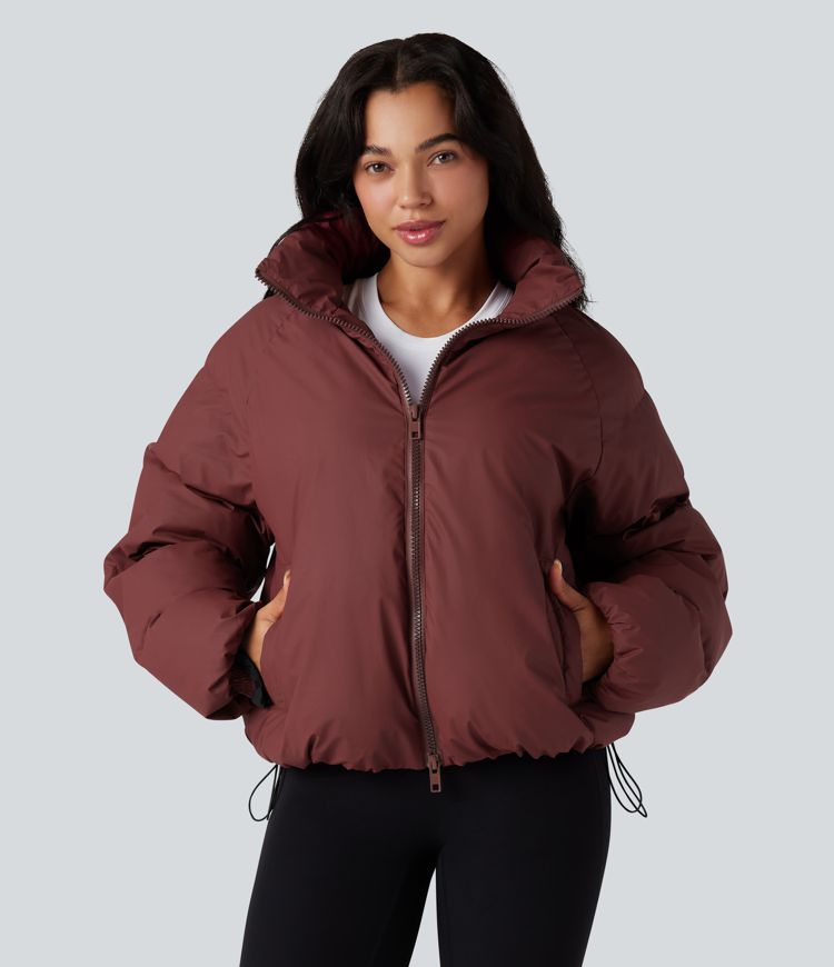 oversize-pufferjacke mit hohem kragen kordelzug am saum und taschen