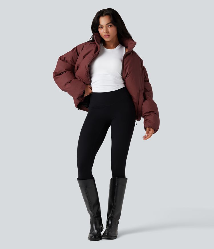 oversize-pufferjacke mit hohem kragen kordelzug am saum und taschen