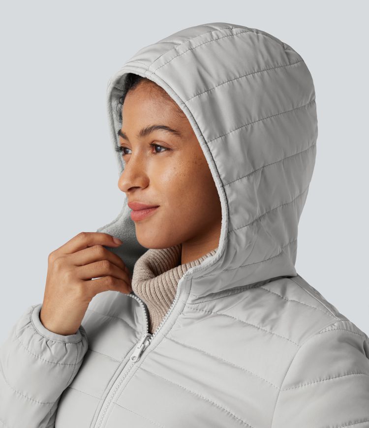 wendbare wattierte fleecejacke mit kapuze reißverschluss langen Ärmeln und taschen zwei looks in einem